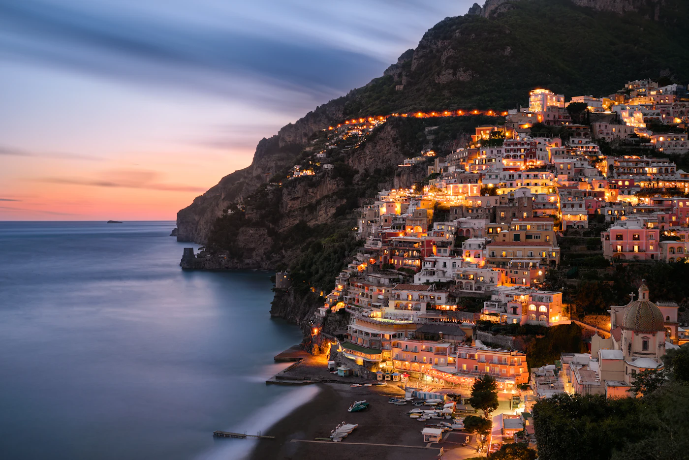 The village of Positano lit up at night on the Amalfi Coast