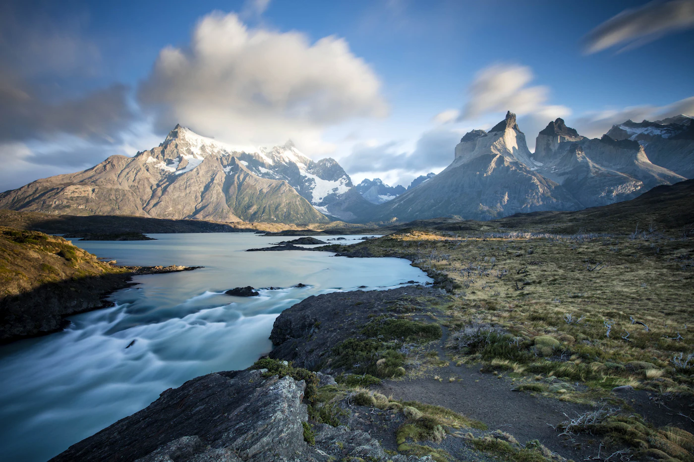 A glacial river running below the peaks of Torres del Paine